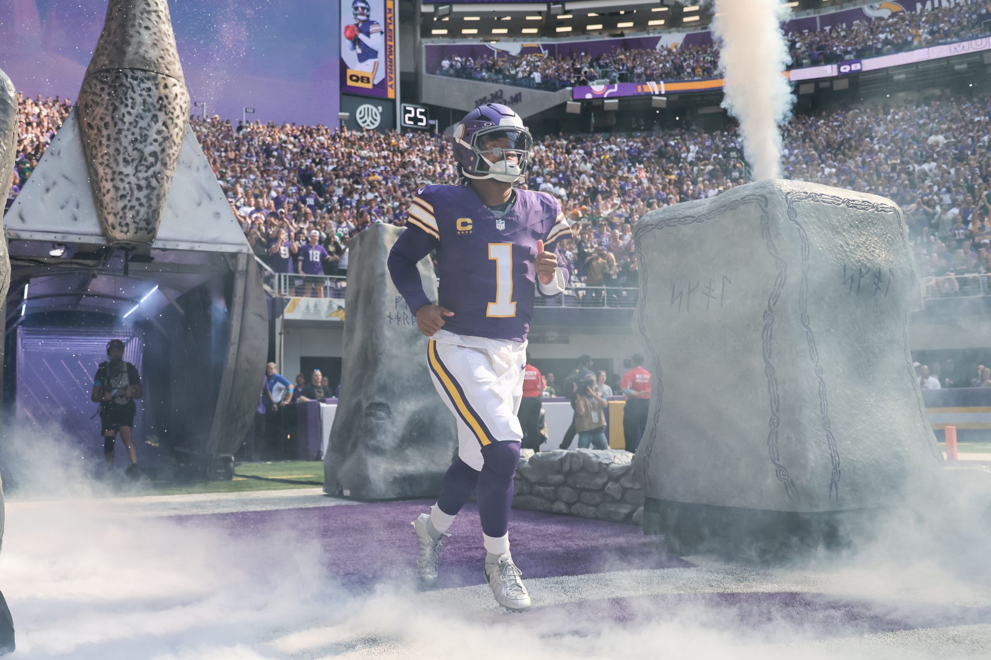 Kyler Murray running out of the tunnel at U.S. Bank Stadium